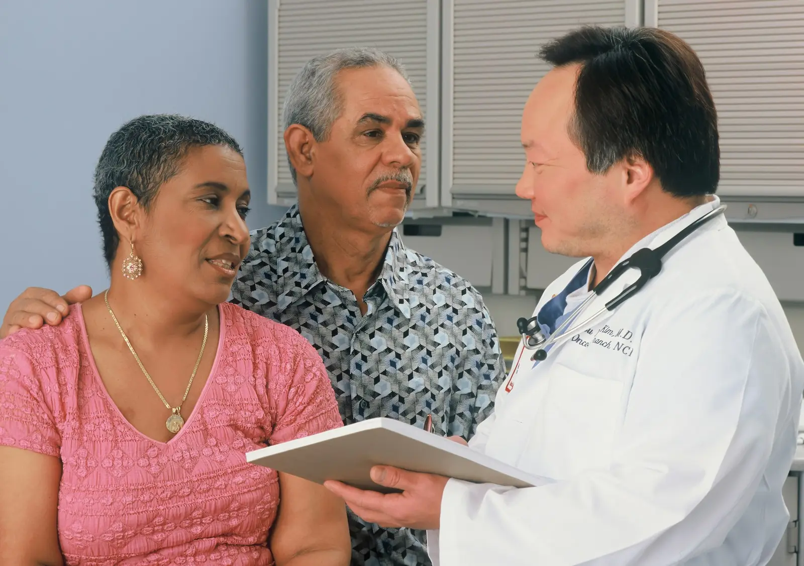 Doctor explaining test results to an elderly couple