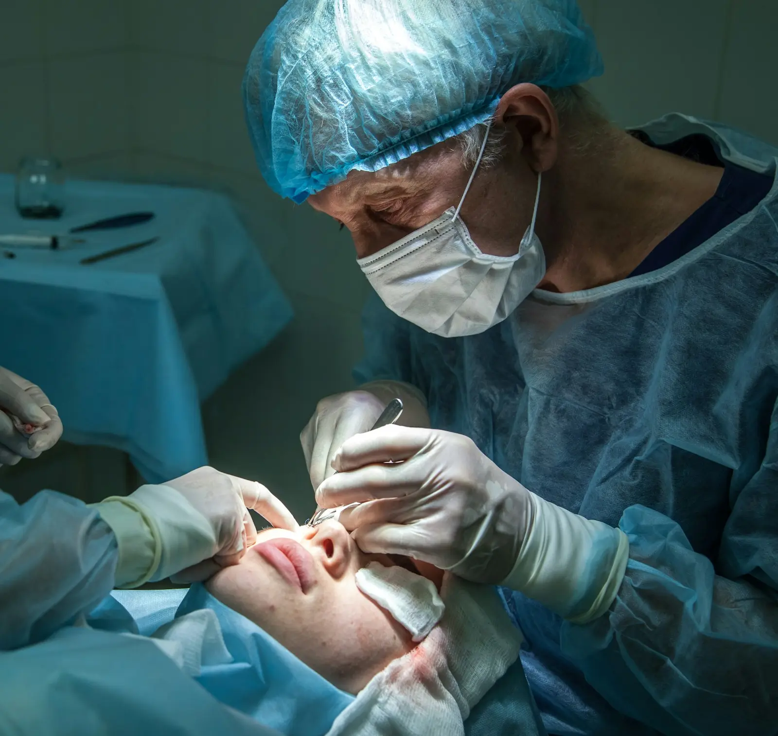 Surgeon operating under a microscope